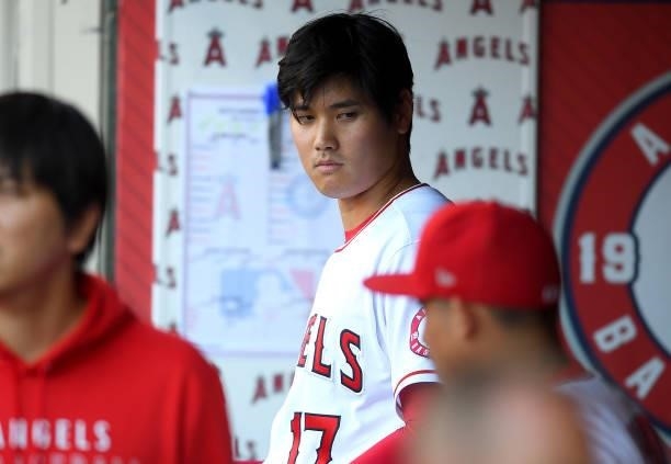 Shohei Ohtani of the Los Angeles Angels in the dugout before the game against the Seattle Mariners at Angel Stadium of Anaheim on July 16, 2021 in...