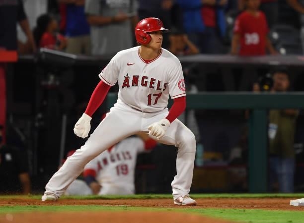 Shohei Ohtani of the Los Angeles Angels takes a lead off third base during the game against the Seattle Mariners at Angel Stadium of Anaheim on July...