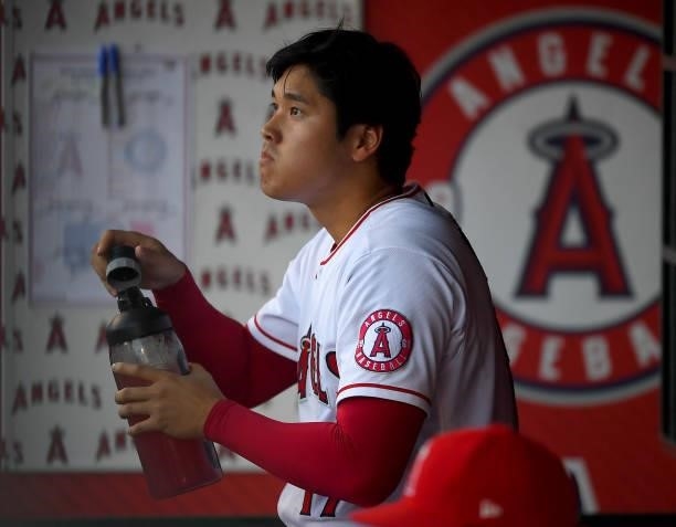 Shohei Ohtani of the Los Angeles Angels in the dugout during the game against the Seattle Mariners at Angel Stadium of Anaheim on July 16, 2021 in...