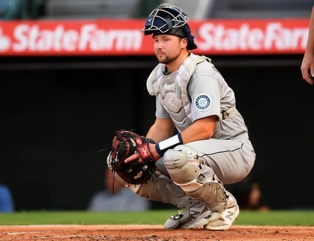 Cal Raleigh of the Seattle Mariners waits behind the plate during the game against the Los Angeles Angels at Angel Stadium of Anaheim on July 16,...