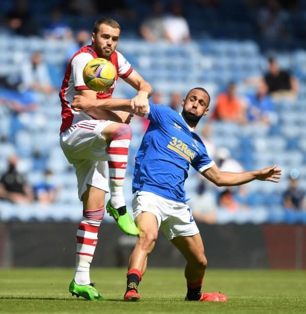 Calum Chambers of Arsenal challenges Kemar Roofe of Rangers during the pre season friendly between Rangers and Arsenal at Ibrox Stadium on July 17,...