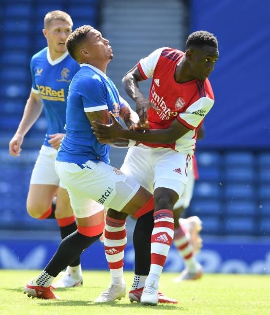 Flo Balogun of Arsenal challenged by James Tavernier Rangers during the pre season friendly between Rangers and Arsenal at Ibrox Stadium on July 17,...