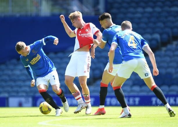 Emile Smith Rowe of Arsenal challenged by Steven Davis of Rangers during the pre season friendly between Rangers and Arsenal at Ibrox Stadium on July...