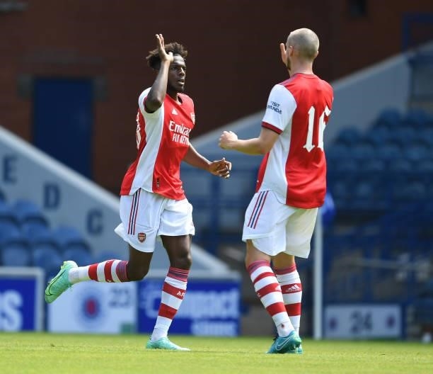 Nuno Tavares celebrates scoring the 1st Arsenal goal with Rob Holding during the pre season friendly between Rangers and Arsenal at Ibrox Stadium on...