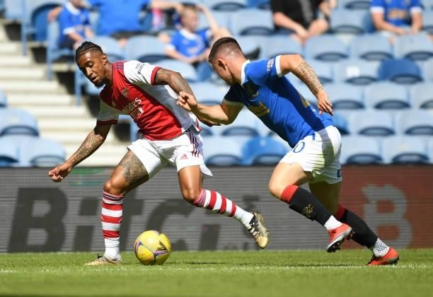 Reiss Nelson of Arsenal takes on Scott Arfield of Rangers during the pre season friendly between Rangers and Arsenal at Ibrox Stadium on July 17,...