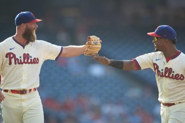 Archie Bradley and Jean Segura of the Philadelphia Phillies react against the Miami Marlins during Game One of the doubleheader at Citizens Bank Park...