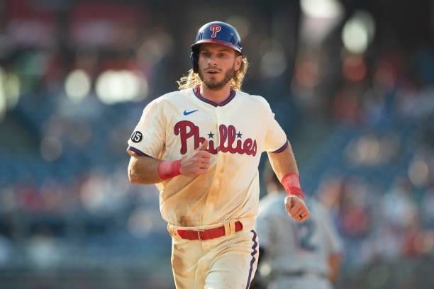 Travis Jankowski of the Philadelphia Phillies makes his way back to first base against the Miami Marlins during Game One of the doubleheader at...