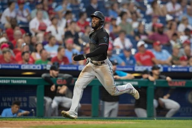 Starling Marte of the Miami Marlins scores a run in the top of the third inning against the Philadelphia Phillies during Game Two of the doubleheader...