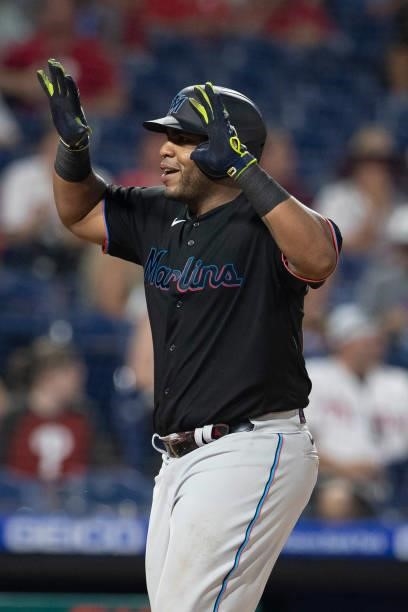 Jesus Aguilar of the Miami Marlins reacts after hitting a three run home run in the top of the fourth inning against the Philadelphia Phillies during...