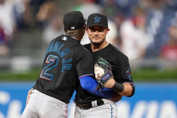 Jazz Chisholm Jr. #2 of the Miami Marlins hugs Miguel Rojas after the game against the Philadelphia Phillies during Game Two of the doubleheader at...