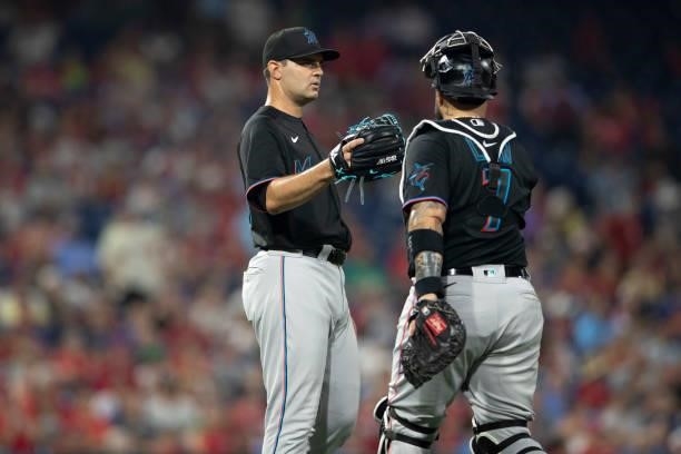 Richard Bleier and Sandy Leon of the Miami Marlins celebrate their win against the Philadelphia Phillies during Game Two of the doubleheader at...