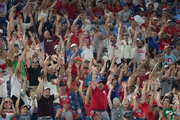 Fans do the wave during the game between the Miami Marlins and Philadelphia Phillies during Game Two of the doubleheader at Citizens Bank Park on...
