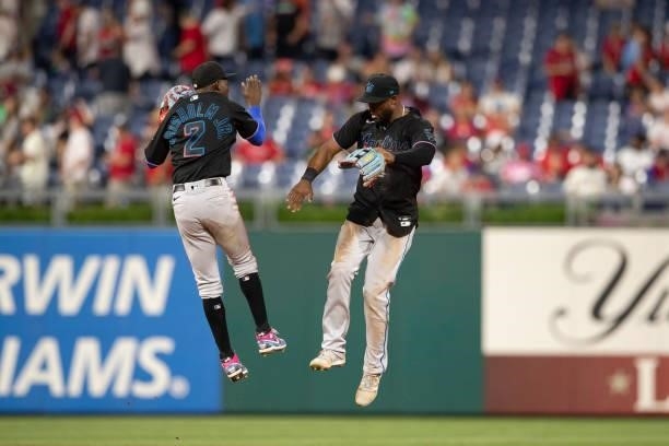 Jazz Chisholm Jr. #2 of the Miami Marlins celebrates with Starling Marte after the game against the Philadelphia Phillies during Game Two of the...