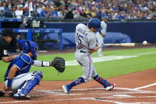 Nick Solak of the Texas Rangers hits a broken-bat ground ball during the second inning against the Toronto Blue Jays at Sahlen Field on July 16, 2021...