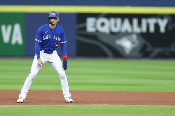 Cavan Biggio of the Toronto Blue Jays leads off of second base during the second inning against the Texas Rangers at Sahlen Field on July 16, 2021 in...