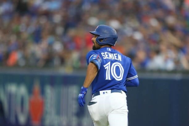 Marcus Semien of the Toronto Blue Jays watches his home run fly over the fence during the third inning against the Texas Rangers at Sahlen Field on...