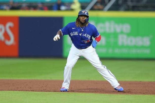 Vladimir Guerrero Jr. #27 of the Toronto Blue Jays leads off of first base during the third inning against the Texas Rangers at Sahlen Field on July...