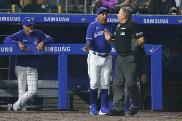Charlie Montoyo of the Toronto Blue Jays argues with umpire Greg Gibson after Gison ejected Montoyo during the sixth inning at Sahlen Field on July...