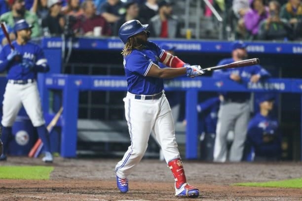 Vladimir Guerrero Jr. #27 of the Toronto Blue Jays hits a three-run home run during the sixth inning against the Texas Rangers at Sahlen Field on...