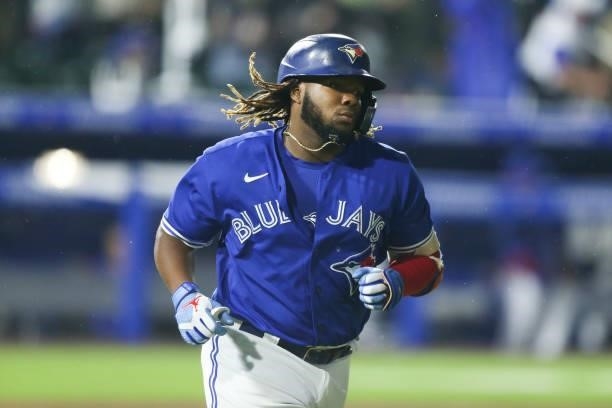 Vladimir Guerrero Jr. #27 of the Toronto Blue Jays runs the bases after hitting a three-run home run during the sixth inning against the Texas...