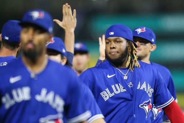 Vladimir Guerrero Jr. #27 of the Toronto Blue Jays celebrates with teammates after the game against the Texas Rangers at Sahlen Field on July 16,...