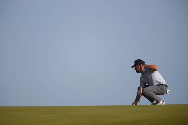 Louis Oosthuizen of South Africa lines up a putt on the tenth green during Day Three of The 149th Open at Royal St George’s Golf Club on July 17,...