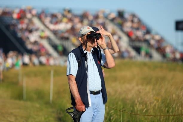 Spectator looks on through binoculars during Day Three of The 149th Open at Royal St George’s Golf Club on July 17, 2021 in Sandwich, England.