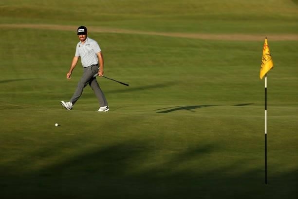 Louis Oosthuizen of South Africa watches his ball after a putt on the 18th hole during Day Three of The 149th Open at Royal St George’s Golf Club on...
