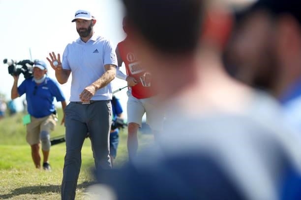Dustin Johnson of The United States acknowledges the crowd during Day Three of The 149th Open at Royal St George’s Golf Club on July 17, 2021 in...
