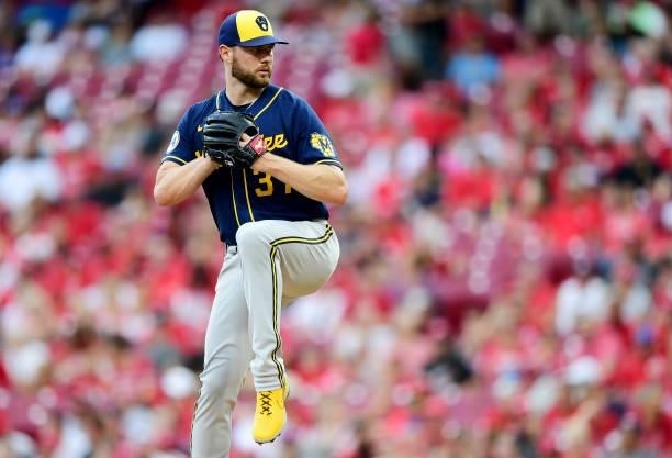 Adrian Houser of the Milwaukee Brewers pitches during a game between the Milwaukee Brewers and Cincinnati Reds at Great American Ball Park on July...