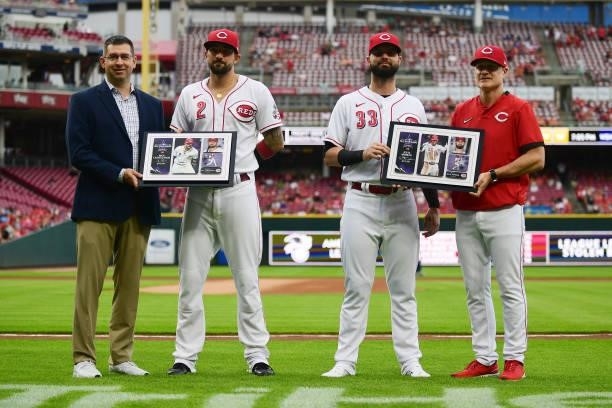Nick Castellanos and Jesse Winker of the Cincinnati Reds are honored with plaques for their All-Star game appearance prior to their game against the...