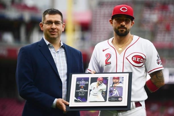 Nick Castellanos of the Cincinnati Reds is honored with a plaque for his All-Star game appearance prior to their game against the Milwaukee Brewers...