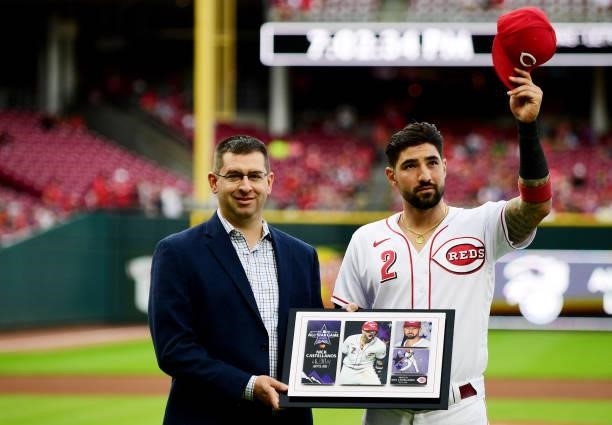 Nick Castellanos of the Cincinnati Reds is honored with a plaque for his All-Star game appearance prior to their game against the Milwaukee Brewers...