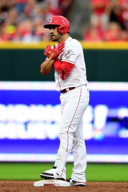 Eugenio Suarez of the Cincinnati Reds reacts after a two-run RBI double during a game between the Milwaukee Brewers and Cincinnati Reds at Great...