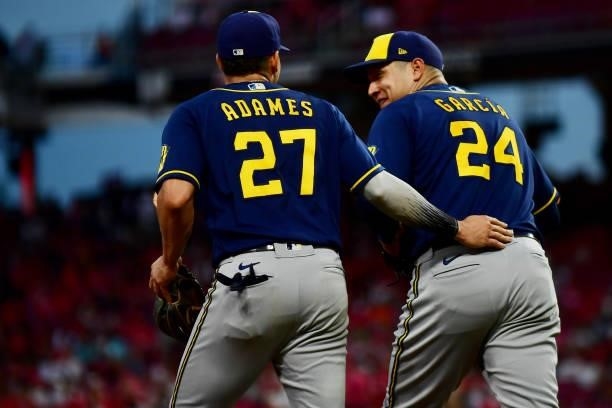 Willy Adames talks to Avisail Garcia of the Milwaukee Brewers during a game between the Milwaukee Brewers and Cincinnati Reds at Great American Ball...