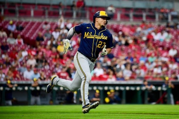 Willy Adames of the Milwaukee Brewers runs to first base during a game between the Milwaukee Brewers and Cincinnati Reds at Great American Ball Park...