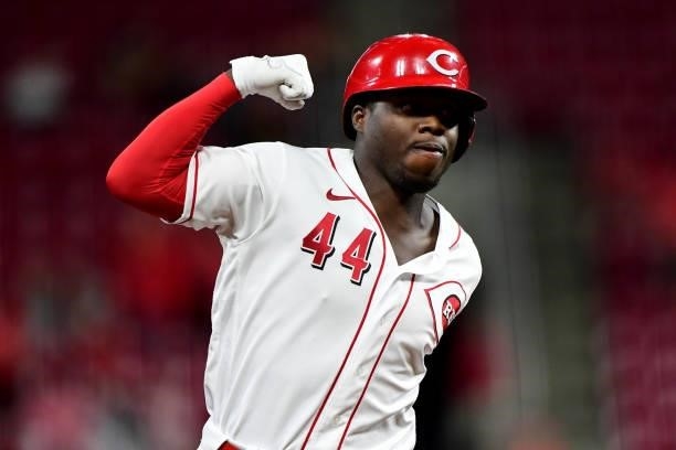 Aristides Aquino of the Cincinnati Reds celebrates his home run during a game between the Milwaukee Brewers and Cincinnati Reds at Great American...