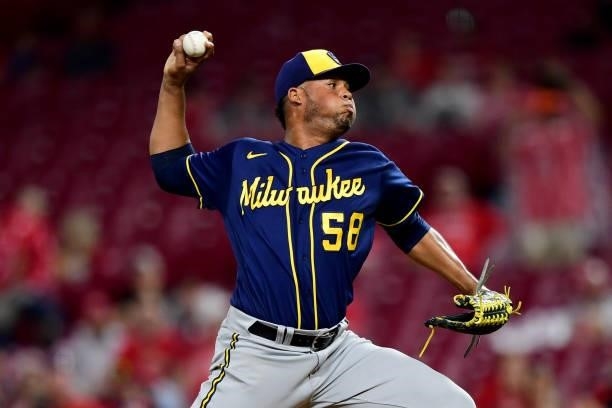 Miguel Sanchez of the Milwaukee Brewers pitches during a game between the Milwaukee Brewers and Cincinnati Reds at Great American Ball Park on July...