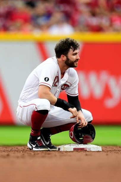 Tyler Naquin of the Cincinnati Reds kneels at second base during a game between the Milwaukee Brewers and Cincinnati Reds at Great American Ball Park...