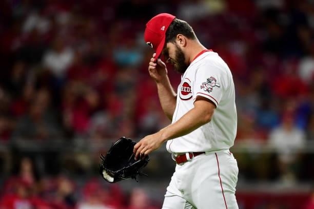 Josh Osich of the Cincinnati Reds is removed from the game during a game between the Milwaukee Brewers and Cincinnati Reds at Great American Ball...