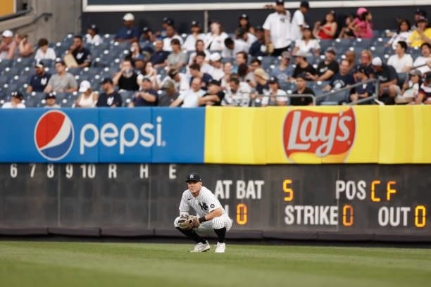 Trey Amburgey of the New York Yankees waits for action during the first inning against the Boston Red Sox at Yankee Stadium on July 16, 2021 in the...