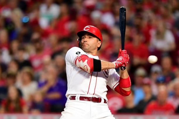Joey Votto of the Cincinnati Reds ducks from a pitch during a game between the Milwaukee Brewers and Cincinnati Reds at Great American Ball Park on...