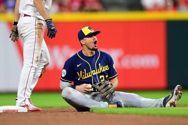 Willy Adames of the Milwaukee Brewers reacts after catching Shogo Akiyama of the Cincinnati Reds stealing second base during a game between the...