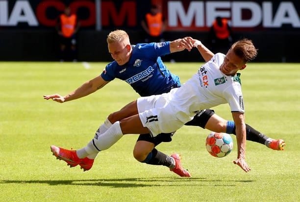 Kai Proeger of Paderborn challenges Sven Michel of Paderborn during the pre-season match between SC Paderborn and Borussia Moenchengladbach at...