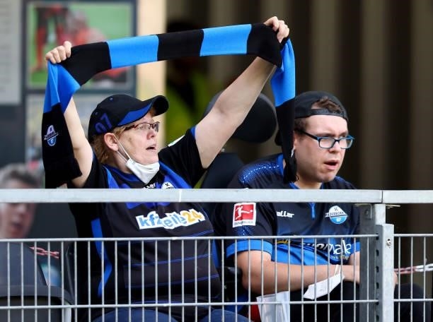 Fans of Paderborn react during the pre-season match between SC Paderborn and Borussia Moenchengladbach at Benteler Arena on July 17, 2021 in...