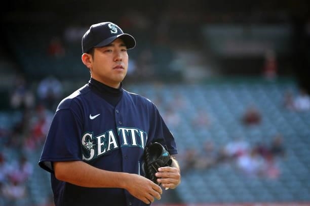 Yusei Kikuchi of the Seattle Mariners looks on before the game against the Los Angeles Angels at Angel Stadium of Anaheim on July 17, 2021 in...
