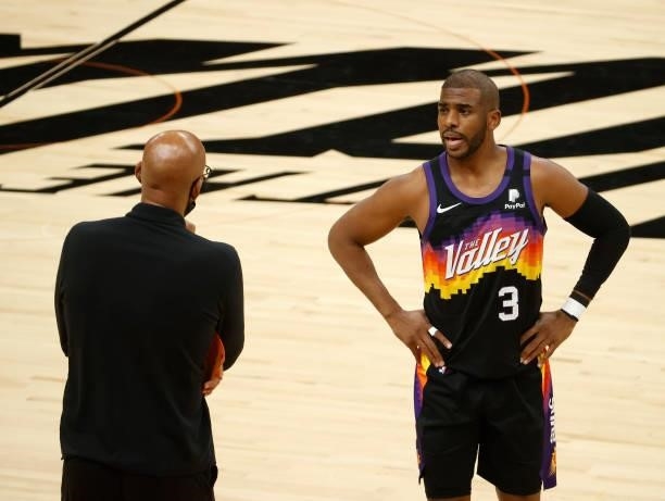 Chris Paul of the Phoenix Suns talks with head coach Monty Williams during the first half in Game Five of the NBA Finals against the Milwaukee Bucks...