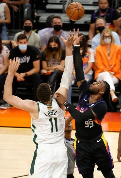 Brook Lopez of the Milwaukee Bucks and Jae Crowder of the Phoenix Suns go up for a jump ball during the first half in Game Five of the NBA Finals at...