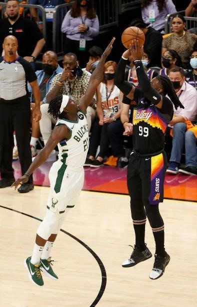 Jae Crowder of the Phoenix Suns shoots against Jrue Holiday of the Milwaukee Bucks during the first half in Game Five of the NBA Finals at Footprint...