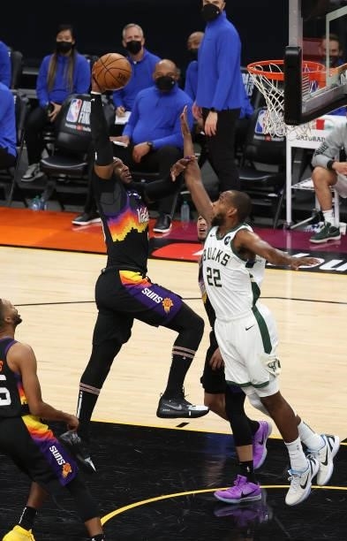 Jae Crowder of the Phoenix Suns dunks against Khris Middleton of the Milwaukee Bucks during the first half in Game Five of the NBA Finals at...